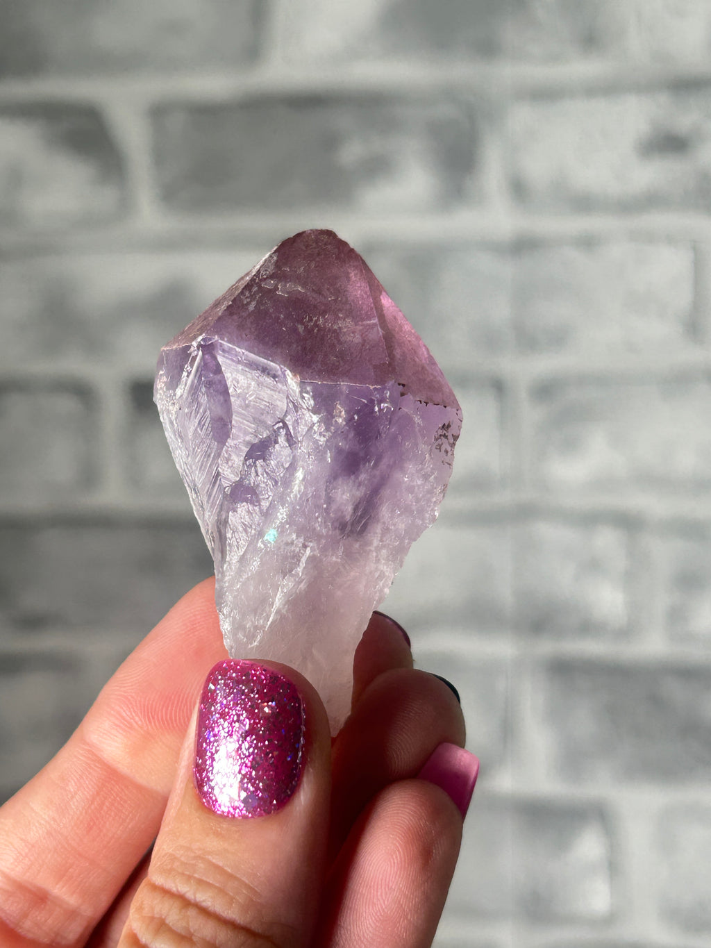 Amethyst with haematite tooth