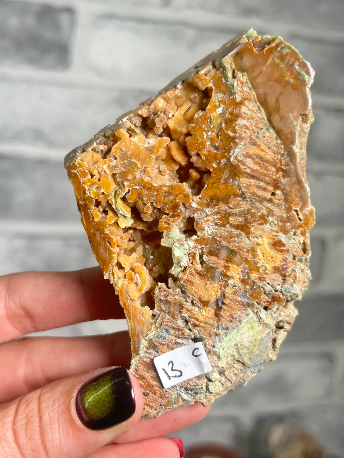 Indonesian Smithsonite trade-name specimen C featuring honey-orange quartz crystal pockets, green garnierite and natural matrix from Indonesia.