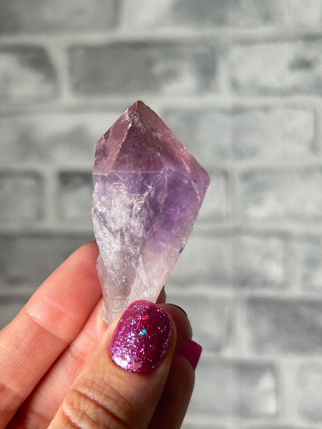 Amethyst with haematite tooth