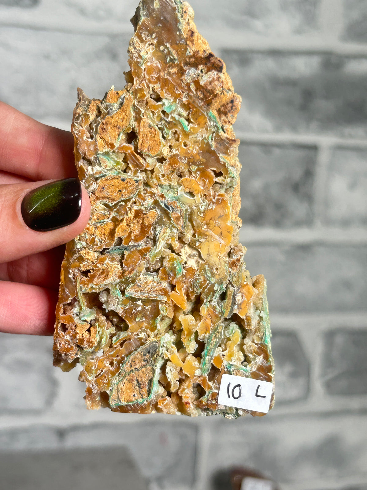 Indonesian Smithsonite trade-name specimen L from Indonesia with honey-orange quartz crystal growth, mint-green garnierite veins and natural cavities.