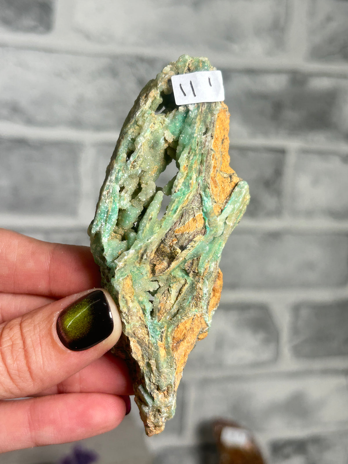 Indonesian Smithsonite trade-name specimen I from Indonesia with mint-green garnierite, crystalline quartz cavity and contrasting rust-orange matrix.