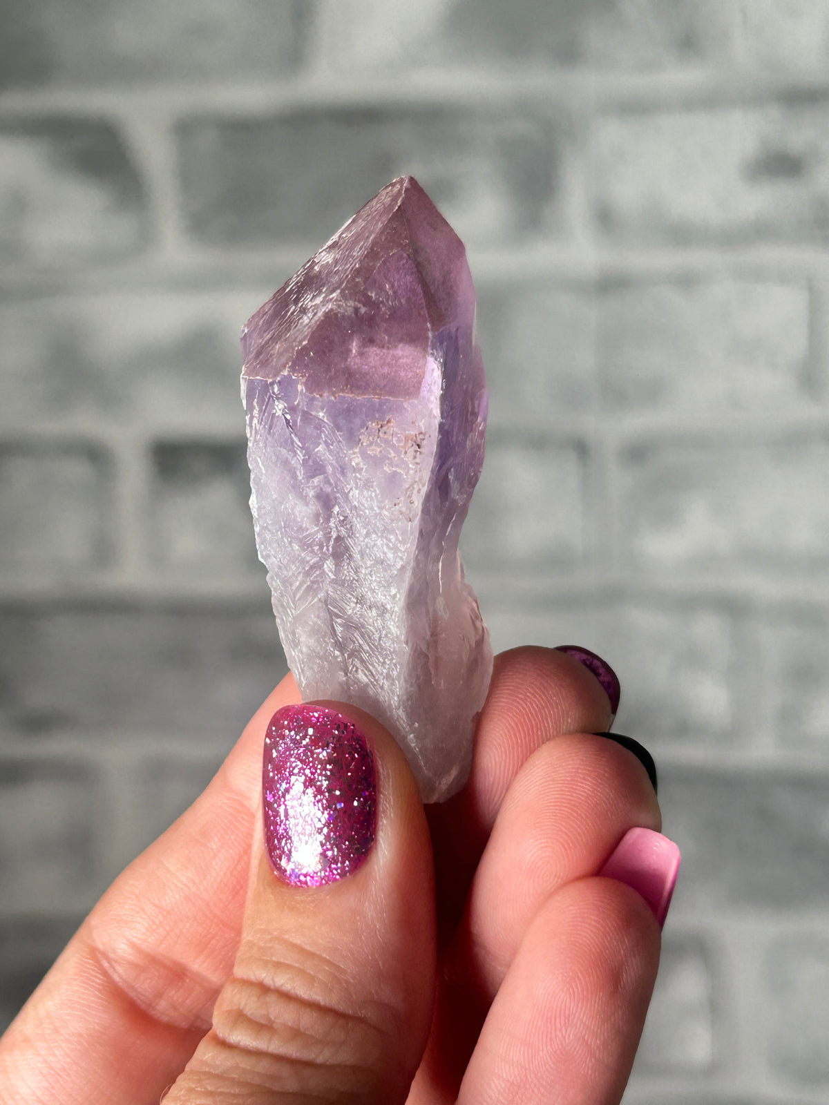 Amethyst with haematite tooth