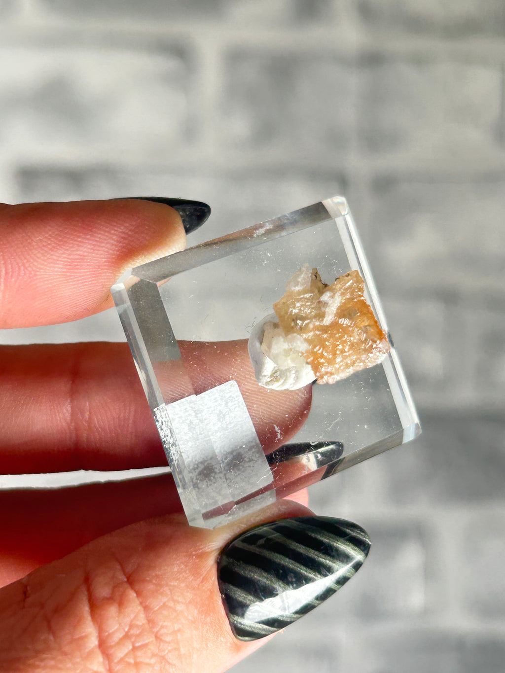 Wulfenite on sugar quartz, Qingyuan, Guangdong Province, China.