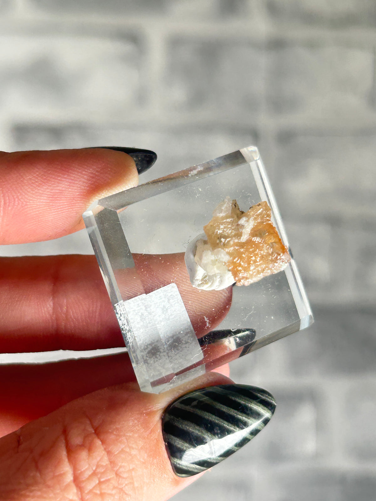 Wulfenite on sugar quartz, Qingyuan, Guangdong Province, China.