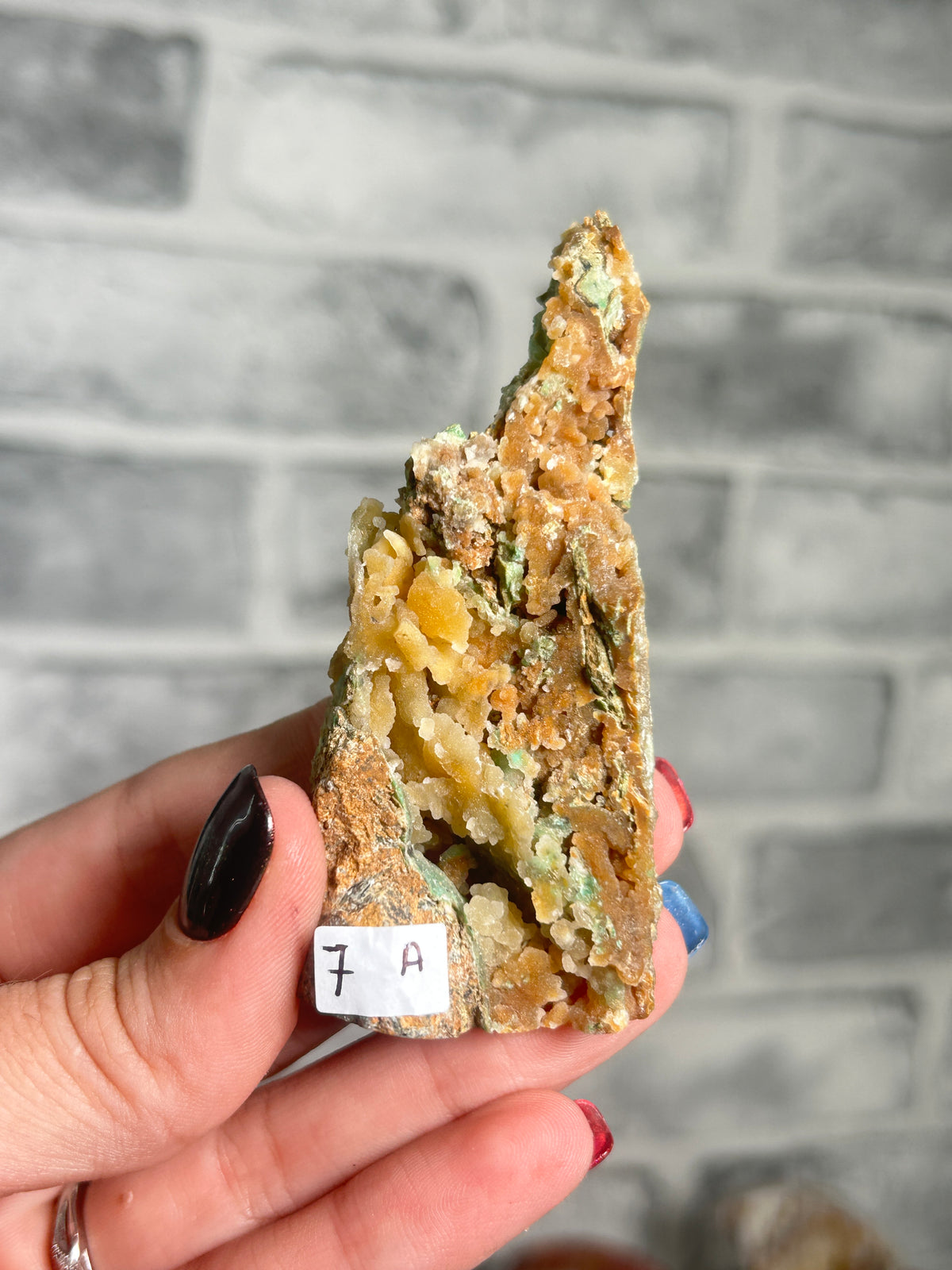 Indonesian Smithsonite trade-name specimen A from Indonesia featuring green garnierite with honey-toned quartz crystals on natural matrix.