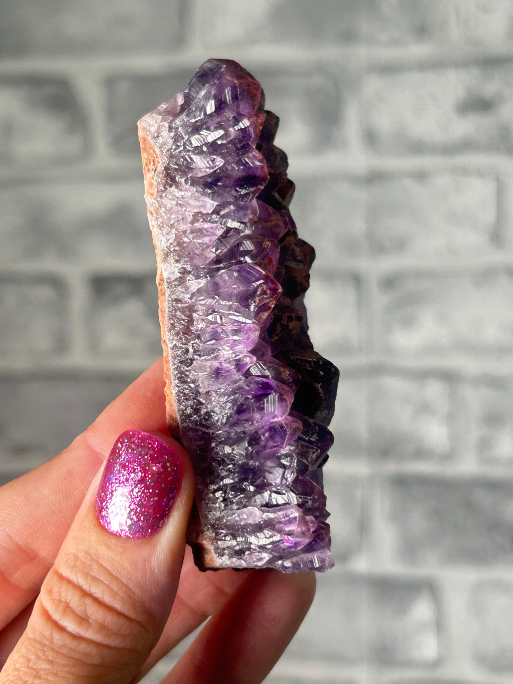 Amethyst with haematite (broken points)￼
