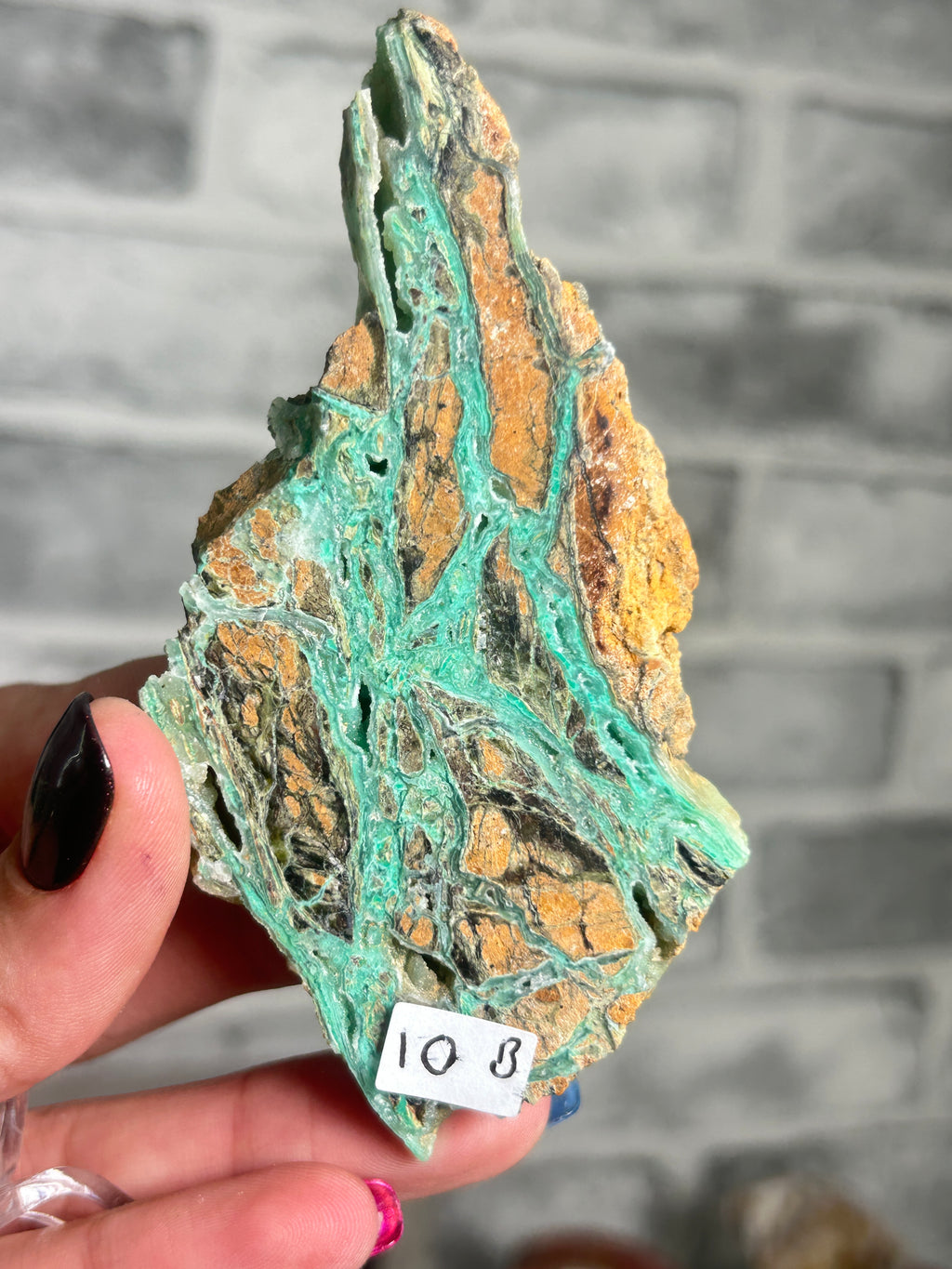 Indonesian Smithsonite trade-name specimen B from Indonesia featuring vivid turquoise-green garnierite veining with quartz through rust-orange natural matrix.