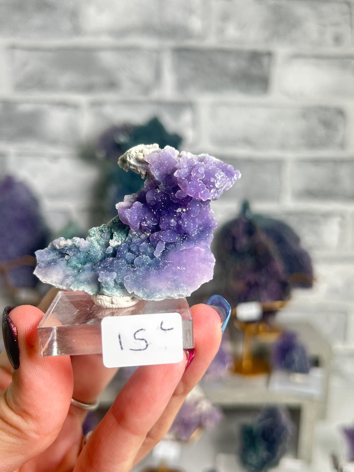 Natural purple and seafoam green grape agate miniature from West Java, Indonesia featuring sparkling botryoidal chalcedony crystals on natural matrix.
