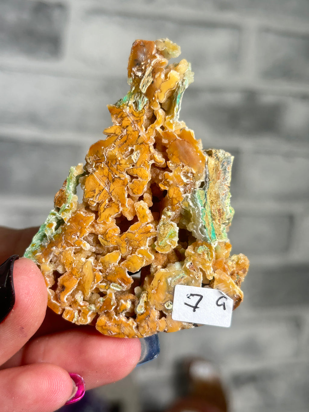 Indonesian Smithsonite trade-name specimen G from Indonesia with amber honey-toned quartz crystal growth, open cavities and green garnierite mineralisation.