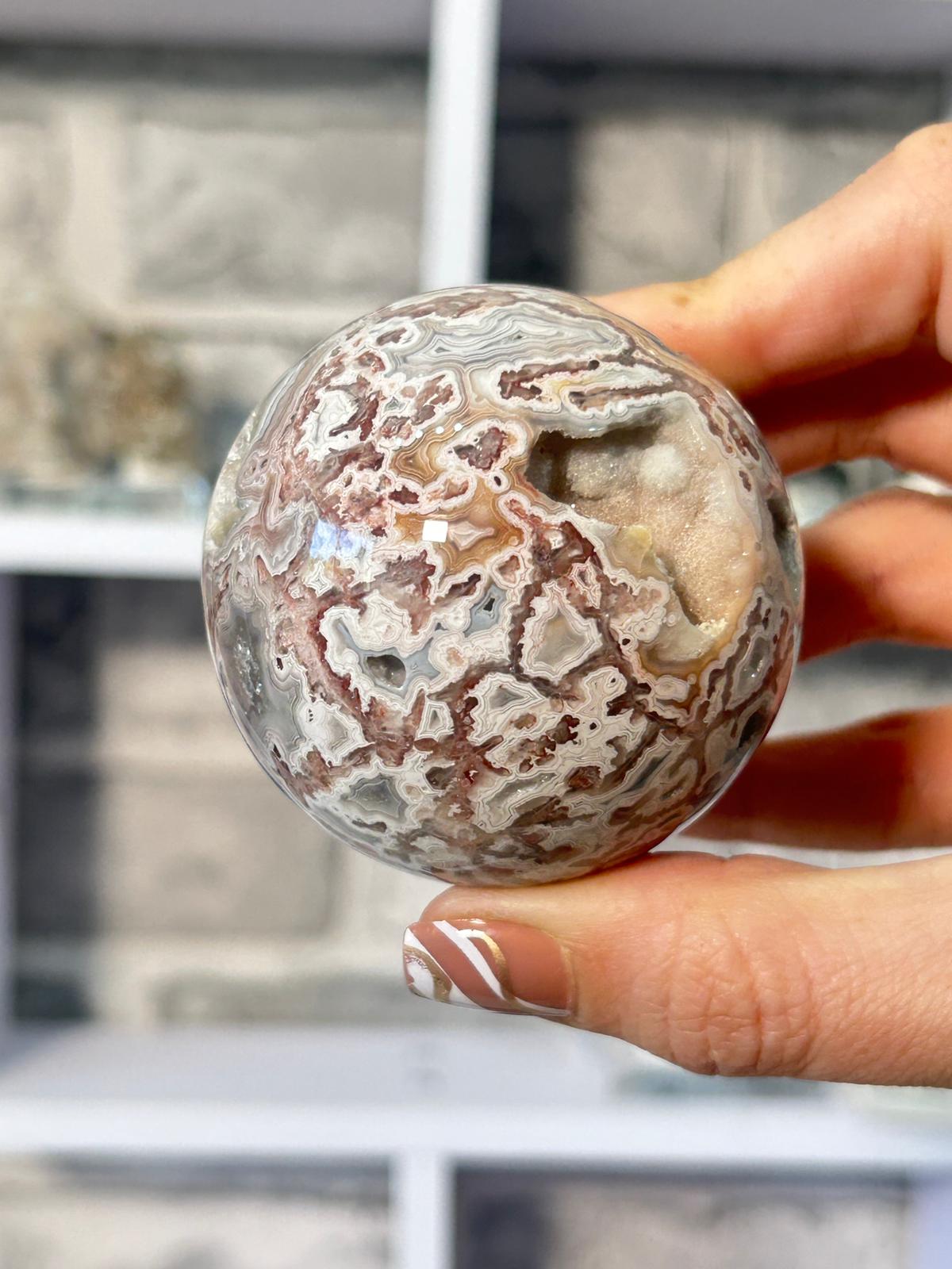 Crazy Lace Agate Sphere With Druzy Pocket