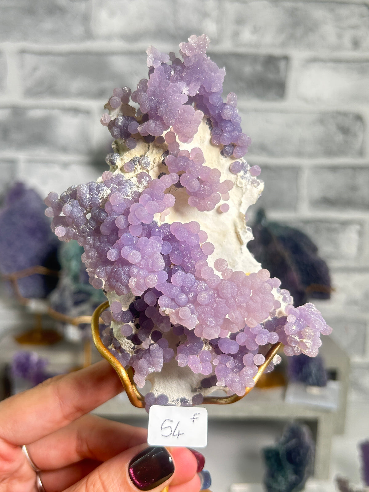 Natural purple grape agate on white matrix from West Java, Indonesia with sparkling lavender botryoidal chalcedony crystals.