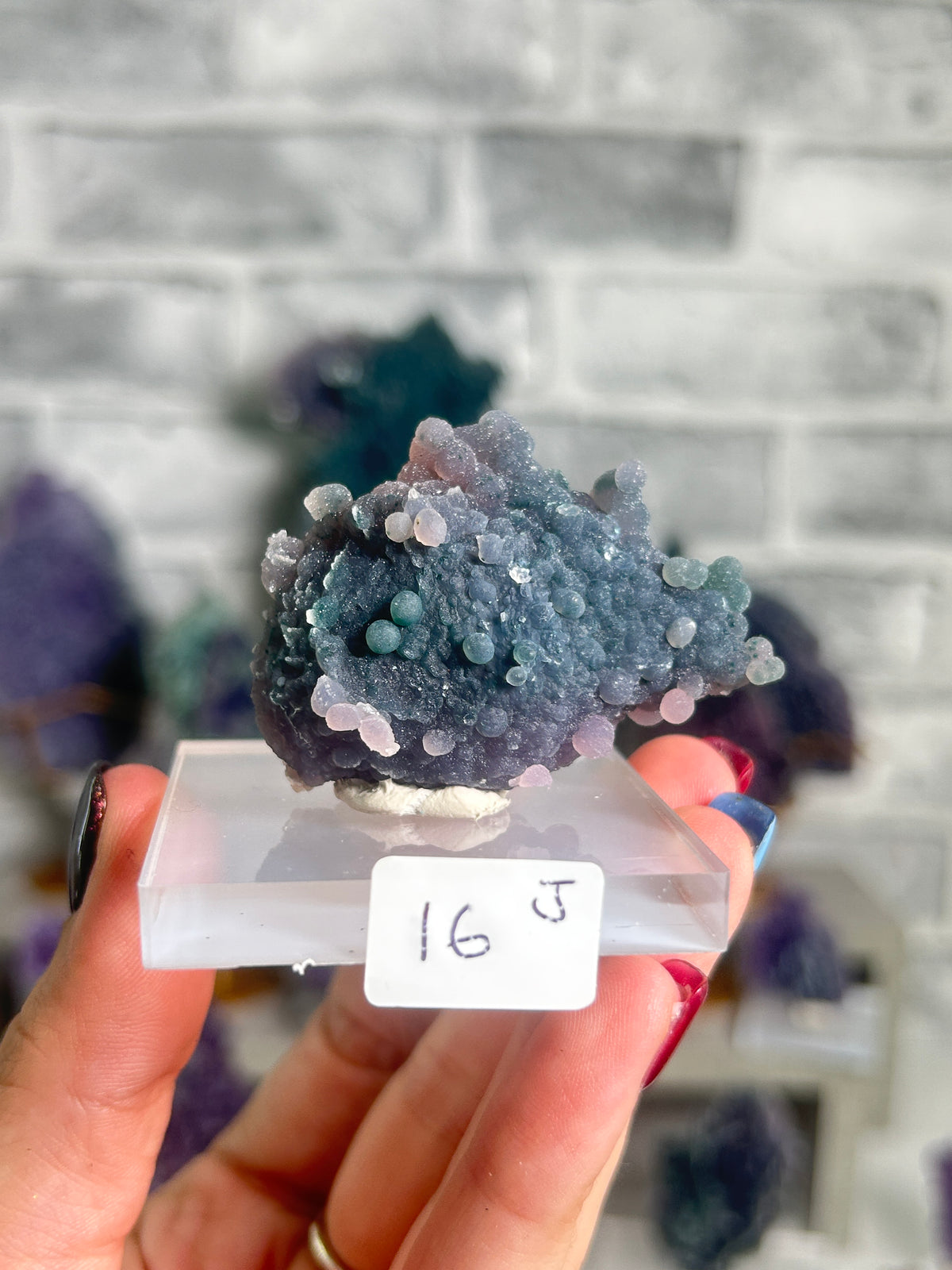 Natural multicoloured grape agate miniature from West Java, Indonesia featuring violet, seafoam-green and pastel pink botryoidal chalcedony crystals.